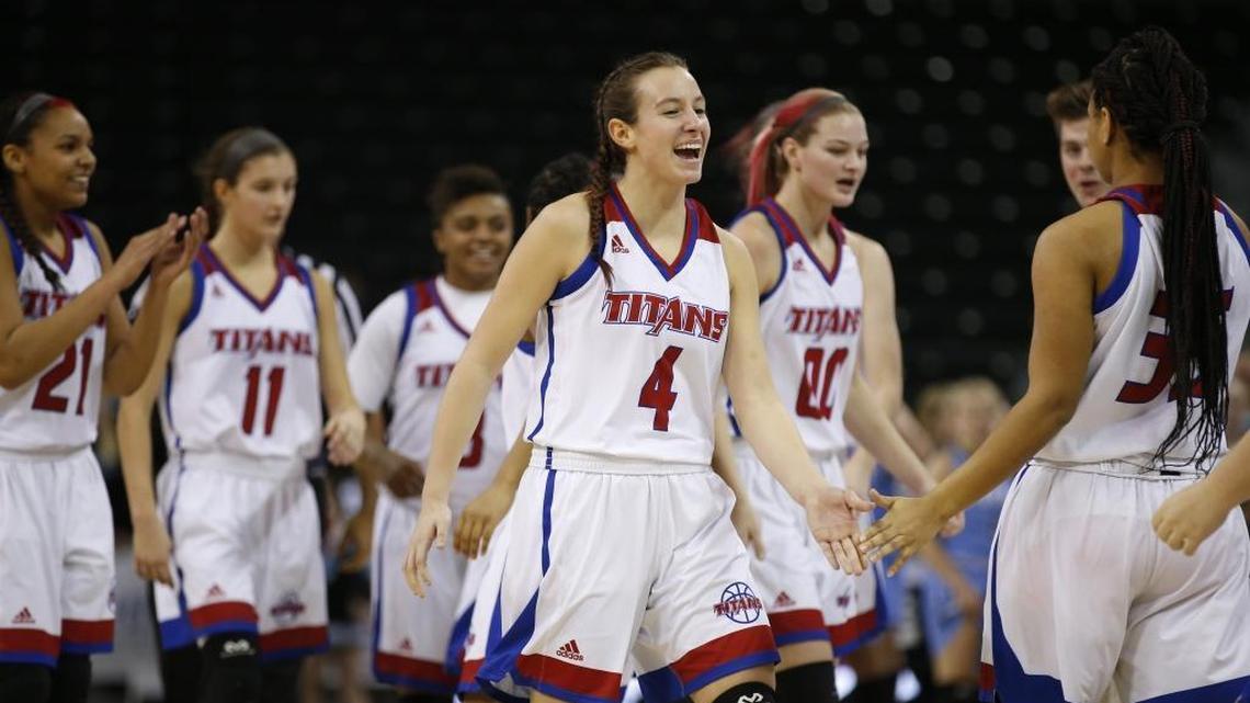 Mercer County's Seygan Robins, 4, and teammates celebrate in the second quarter against Mercy during the championship game of the St. Elizabeth Healthcare/KHSAA Girls' Sweet 16 basketball tournament played at BB&T Arena in Highland Height, Ky. Sunday March 11, 2018.