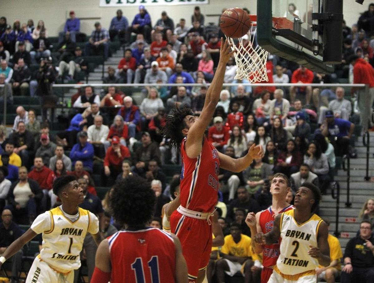 Scott County's Michael Moreno shoots against Bryan Station at Bryan Station gym in Lexington, Ky., Monday, January 22, 2018.