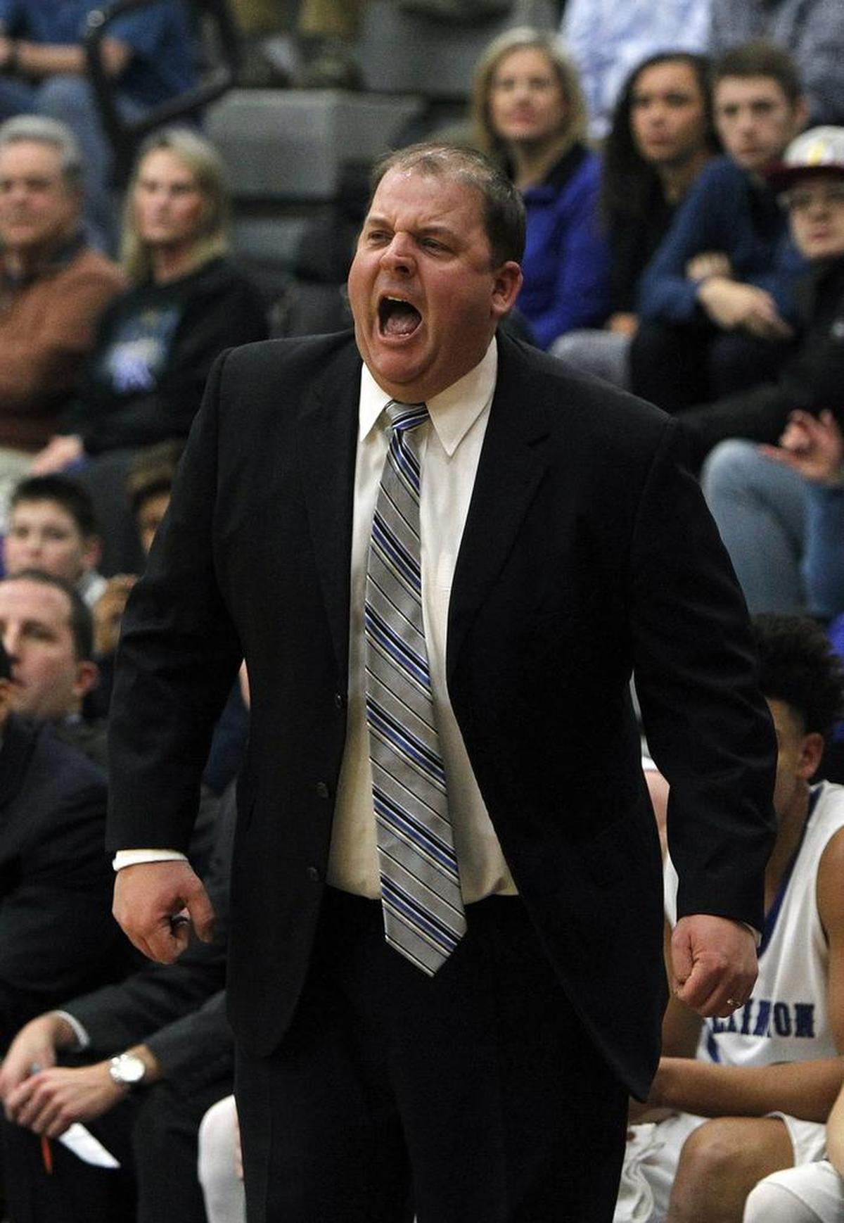 Lexington Catholic head coach Brandon Salsman reacts against Lexington Christian in the Bueter Gymnasium at Lexington Catholic in Lexington, Ky., Tuesday, January 2, 2018.
