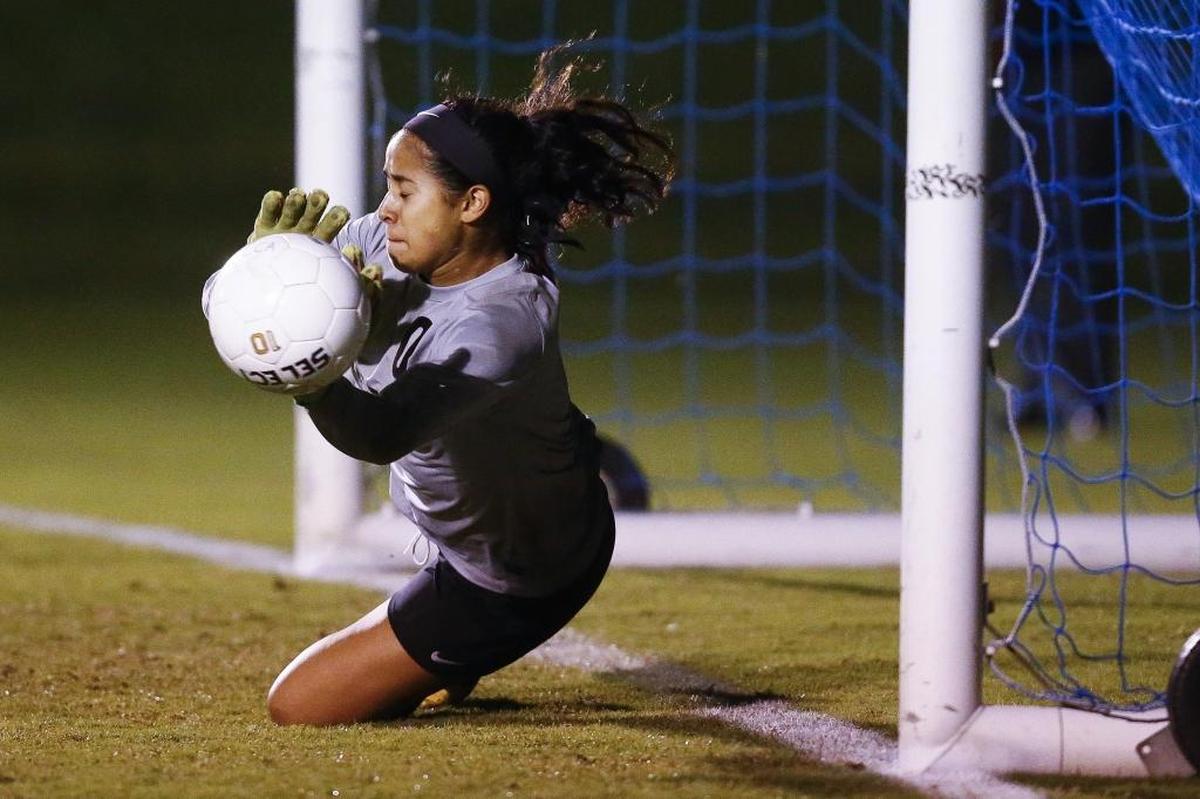 Tates Creek's Jenna Shalash (0) blocks a shot during their 43rd District semifinal soccer game against Paul Laurence Dunbar at Lexington Christian Academy in Lexington, Ky., Wednesday, Oct. 11, 2017. Tates Creek beat Paul Laurence Dunbar 3-2 on Penalty Kicks.