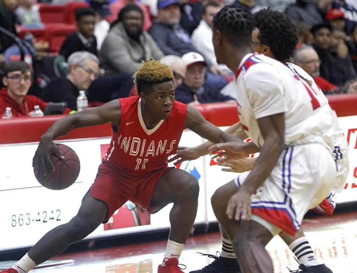 Adair County freshman Zion Harmon moved the ball Monday while playing host Scott County. Harmon passed the 2,000 point mark for his varsity career during the game.