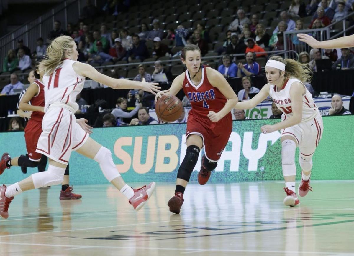 Mercer County Seygan Robins (4) was guarded by Boyd County Graci Borders (11) left and Boyd County Savannah Wheeler (4) in the second quarter of a first round Girls Sweet Sixteen tournament basketball game at BB&T Arena in Highland Heights, Ky, on March 8, 2017.