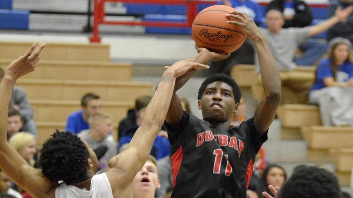 Paul Laurence Dunbar’s Taveion Hollingsworth took a shot against Madison Central on Jan. 6, 2015, in Richmond.