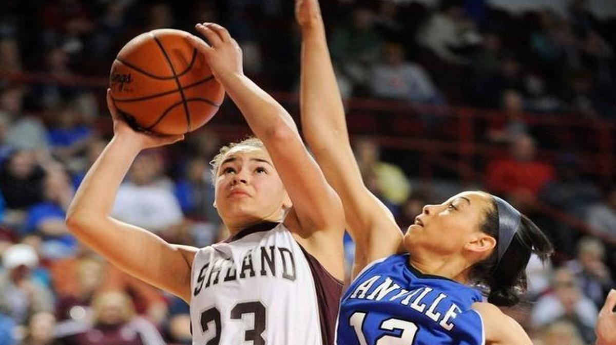 Ashland Blazer’s Mykasa Robinson (23) shoots past Danville's Cameron McPherson (12) during their quarterfinal game in the Houchens Industries/KHSAA Girls' Sweet 16 at E.A. Diddle Arena in Bowling Green, Ky., Friday March, 14, 2014.