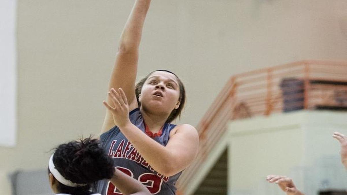Lafayette Kiara Pankins (22) shot over Lafayette Shelbi Wilson (23) as host Dunbar defeated Lafayette 57-51 on Tuesday Jan. 24, 2017 in Lexington, Ky.