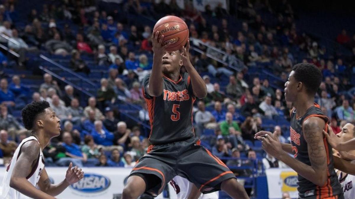 Fern Creek Anthony Wales (5) drove the lane as Fern Creek defeats Ballard 55-52 in the quarter finals of the Whitaker Bank/KHSAA Boys' Sweet 16 at Rupp Arena on Friday March 17, 2017 in Lexington, Ky.