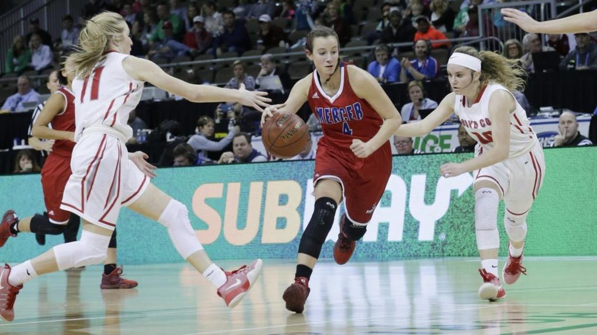 Mercer County Seygan Robins (4) was guardec by Boyd County Graci Borders (11) left and Boyd County Savannah Wheeler (4) in the second quarter of a first round Girls Sweet Sixteen tournament basketball game at BB&T Arena in Highland Heights, Ky, on March 8, 2017.