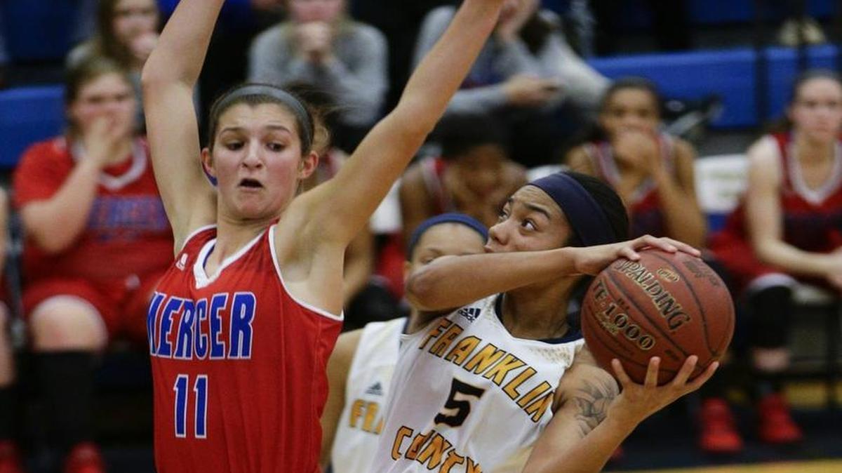 Franklin County's Princess Stewart, 5, scored over Mercey County's Faith Lake, 11, as Mercer Defeated Franklin County 72-63 on Thursday January 12, 2017 in Frankfort, Ky.