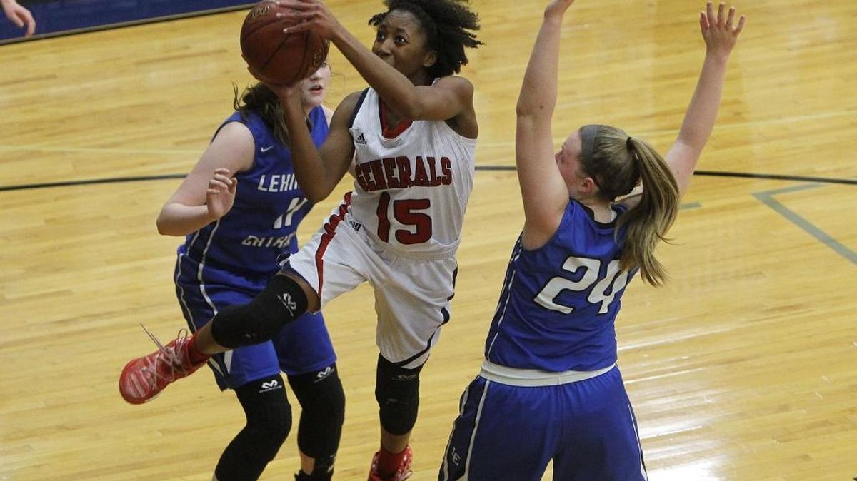 Lafayette's Tekiya Garr-Carter shoots against LexCath during the semifinals of the 43rd district tournament in the Beuter Gymnasium in Lexington, Ky., Tuesday, February 21, 2017.