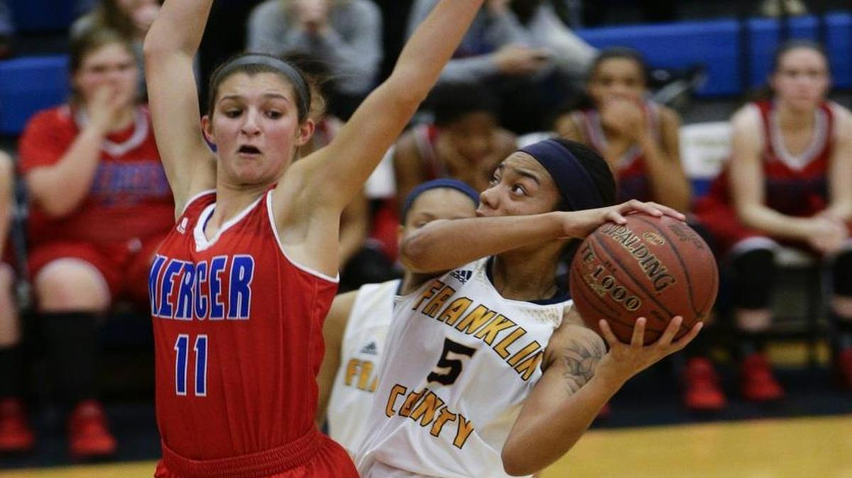 Franklin County's Princess Stewart (5) scored over Mercey County's Faith Lake (11) on Jan. 12 in Frankfort.