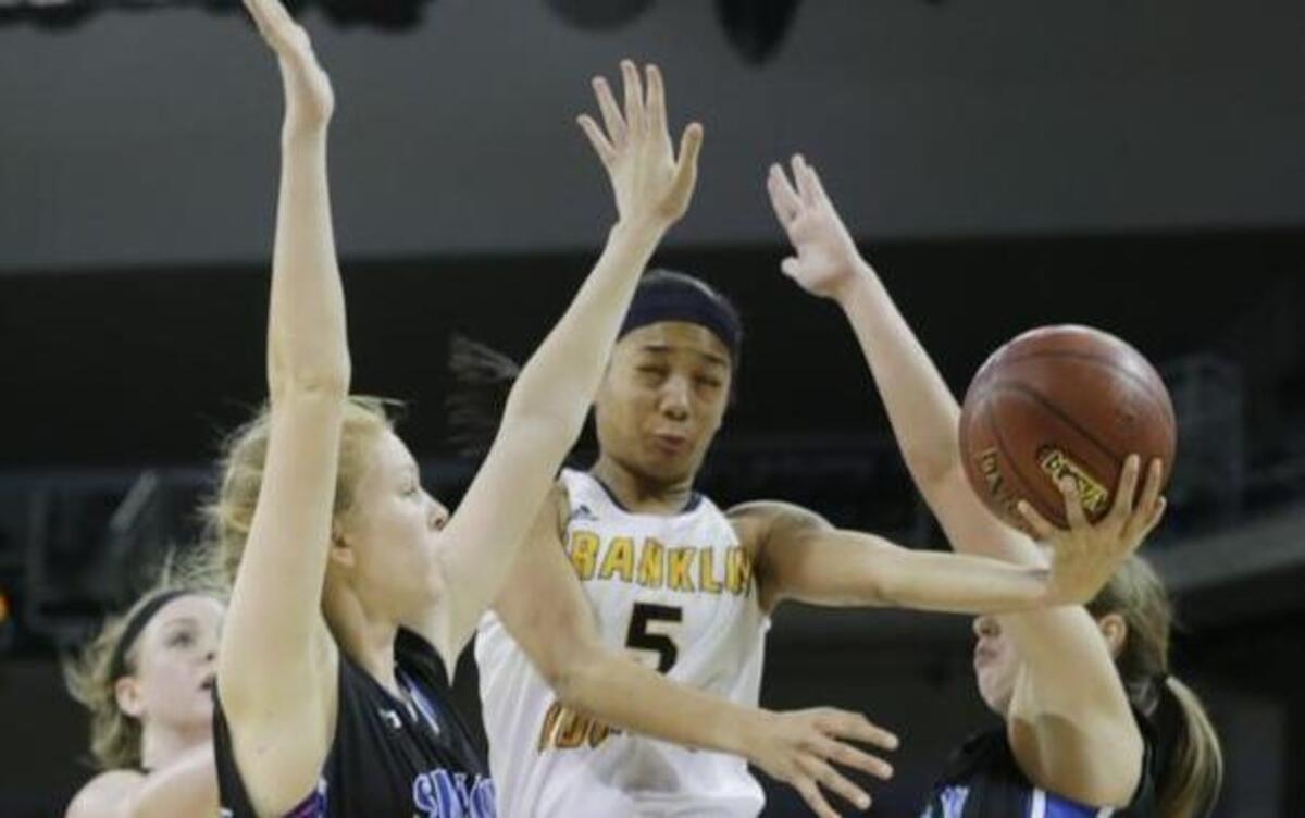 Franklin Co. Princess Stewart (5) was heavily defended under the basket by Simon Kenton in the fourth quarter of the quarterfinal round of the Girls’ Sweet Sixteen tournament basketball game at BB&T Arena in Highland Heights, Ky, on March 10, 2017. Franklin Co. beat Simon Kenton 51-49.