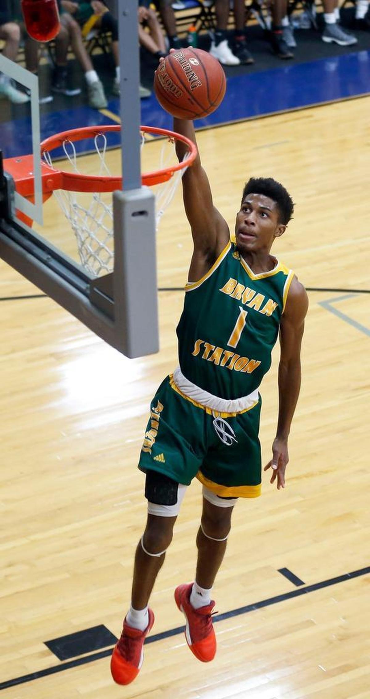 Bryan Station's Terrance Clayton-Murphy (1) scored on a breakaway dunk as Bryan Station High School played University University Heights in theTraditional Bank Holiday Classic played at Lexington Catholic High School in Lexington Ky., Wednesday, December 27, 2017. Bryan Station won 82-69.
