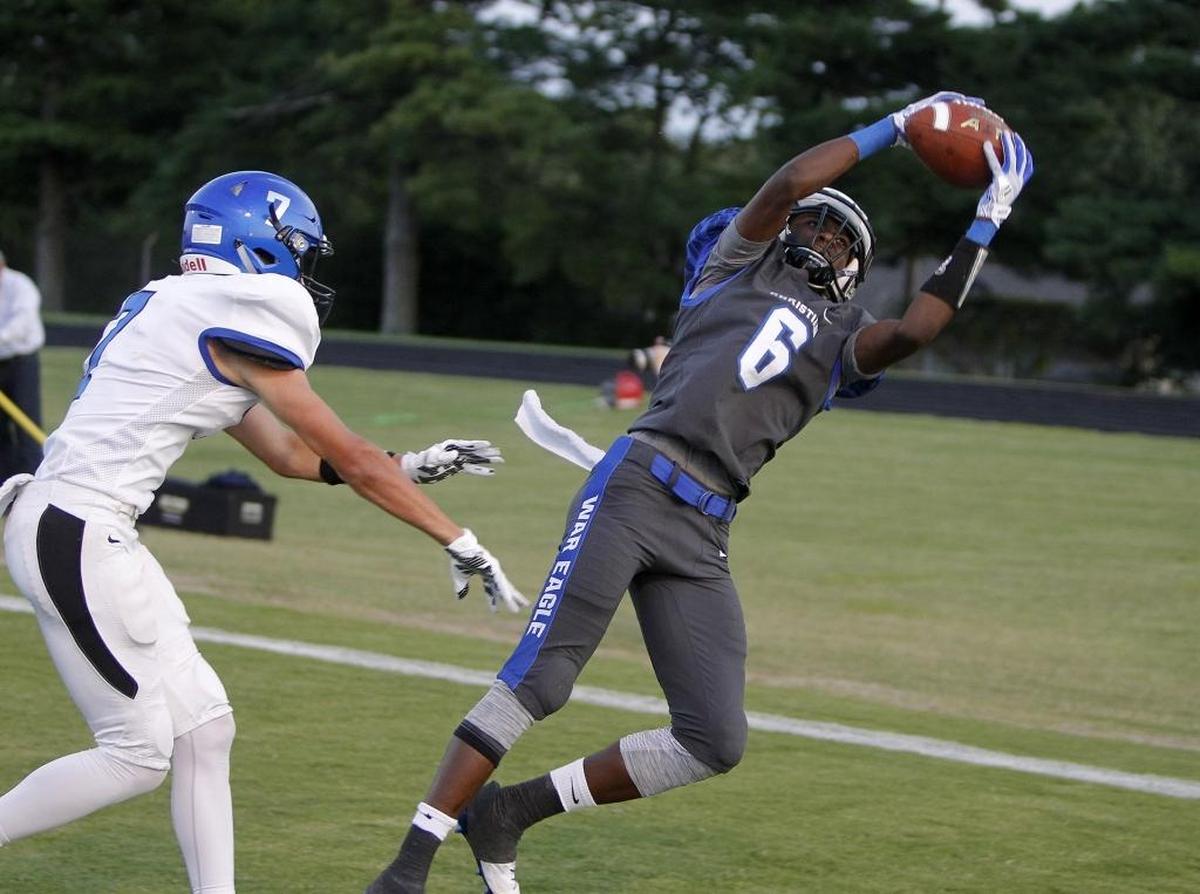 LCA's Dearious Smith reaches for a touchdown reception against Lexington Catholic's Carson Brownell at Lexington Christian Academy in Lexington, Ky., Friday, September 8, 2017.