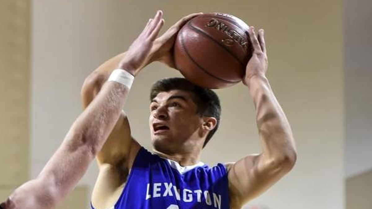 LCA's Kyle Rode (22) shoots over Sayre's Will Newton (15), during the championship of the boys 11th Region All-A Classic Tournament, Saturday, January 21, 2017, at EKU's McBrayer Arena in Richmond.