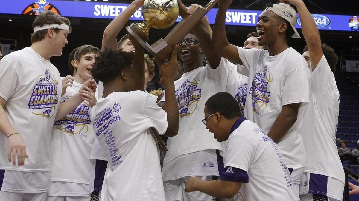 Bowling Green players celebrate with the trophy after defeating Cooper to win the Whitaker Bank/KHSAA Boys' Sweet 16 at Rupp Arena in Lexington, Ky., Sunday, March 19, 2017.