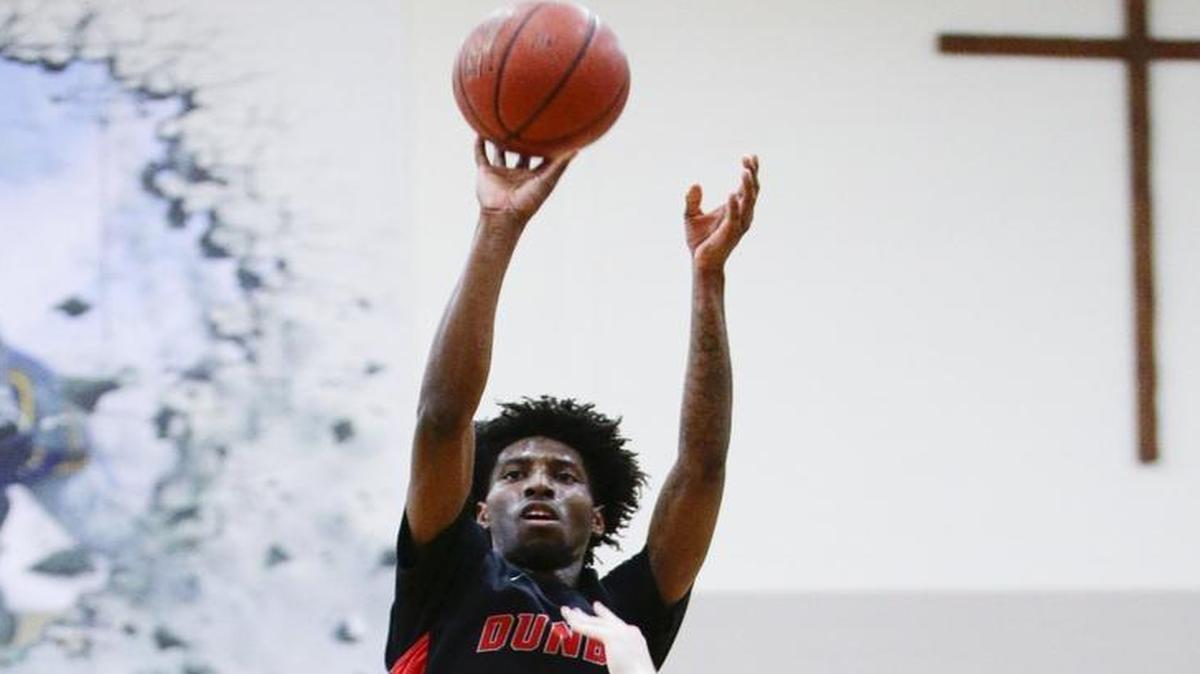 Dunbar's Taveion Hollingsworth put in two of his 10 points as Lexington Catholic defeated Dunbar 53-52 on Thursday January 18, 2017 in Lexington, Ky.