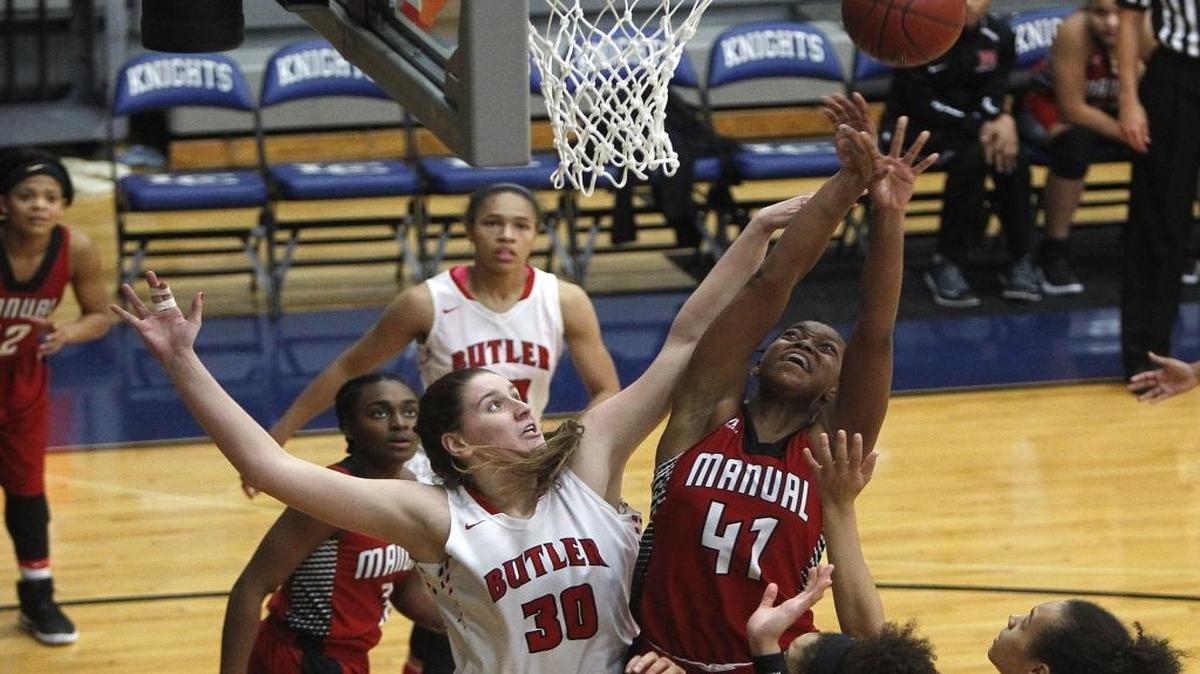 Manual's Nila Blackford is pressured by Butler's Molly Lockhart as she shoots in the finals of the Traditional Bank Holiday Classic in the Beuter Gymnasium at in Lexington, Ky., Friday, Dec. 23, 2016.