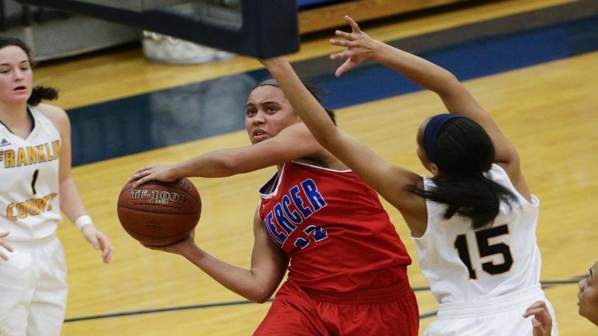 Mercer County's Lyric Houston drove past Franklin County’s Olivia Hogan for a basket on Jan. 12.