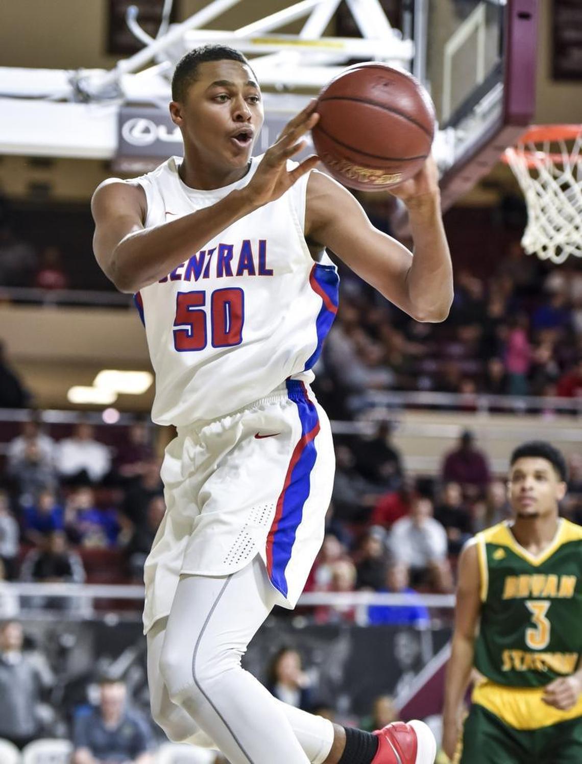 Madison Central’s Isaiah Cozart (50) tries to save the ball back inbounds against Bryan Station, during the first round of the 11th Region tournament, Wednesday night, February 28, 2018, at EKU’s McBrayer Arena in Richmond.