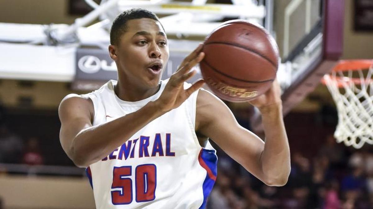 Madison Central’s Isaiah Cozart (50) tries to save the ball back inbounds against Bryan Station, during the first round of the 11th Region tournament, Wednesday night, February 28, 2018, at EKU’s McBrayer Arena in Richmond.
