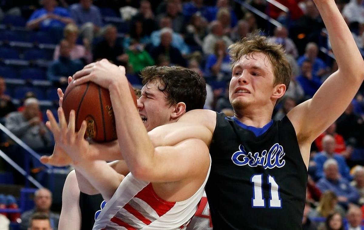 Corbin's Chase Sanders (10) battled Estill County’s J.T. O'Hair (11) for a rebound as Corbin played Estill County in the opening game at the 101st Whitaker Bank/KHSAA Boys' Sweet Sixteen state basketball tournament being played Wednesday at Rupp Arena in Lexington. Corbin won 50-40.