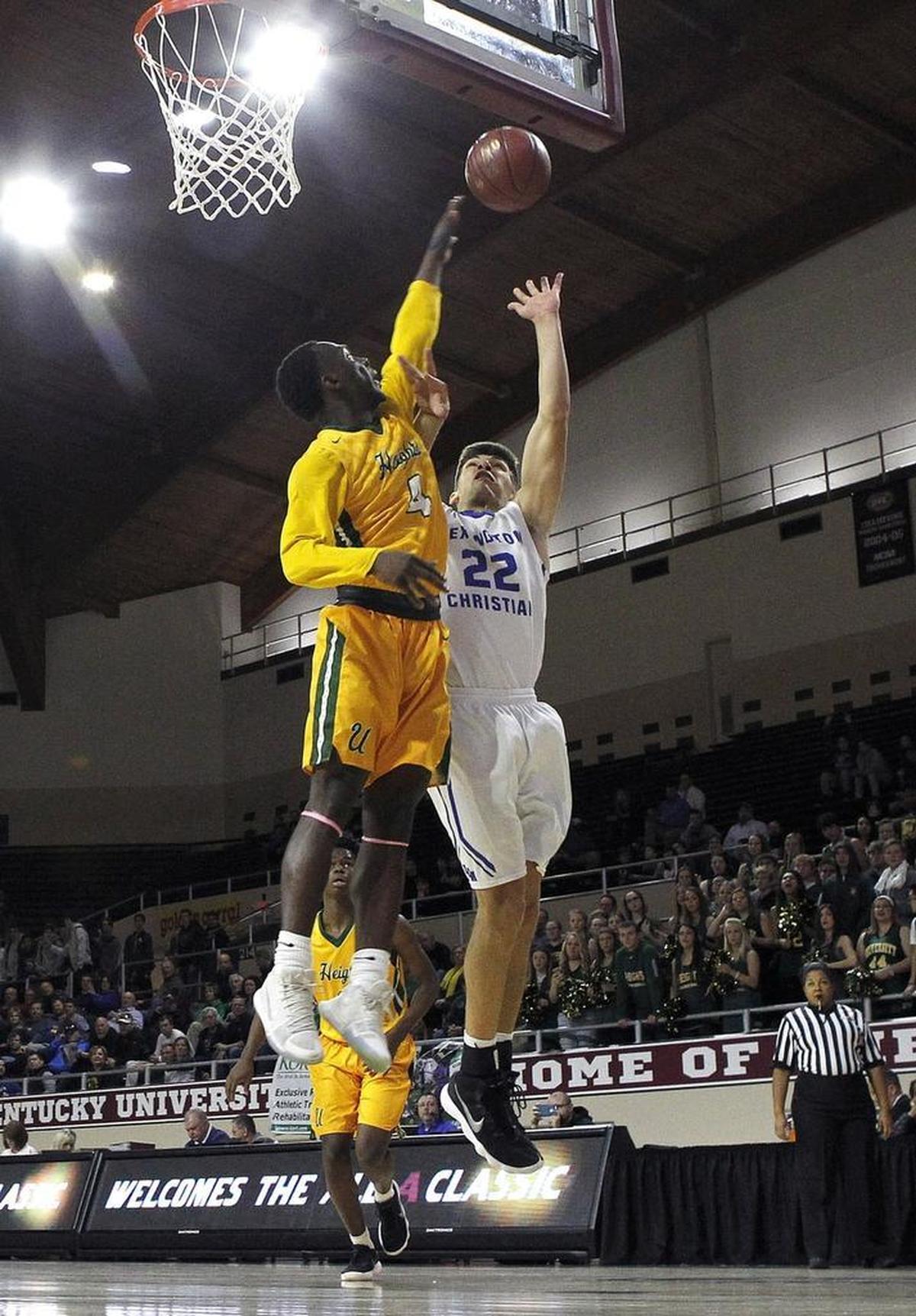 Lexington Christian’s Kyle Rode shoots against University Heights’ Taquan Hollowell in the first round of the All 'A' Classic at Alumni Coliseum in Richmond, Ky., Thursday, January 25, 2018.