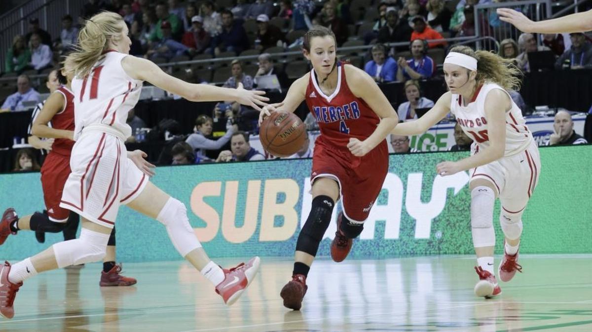 Mercer County Seygan Robins (4) was guardec by Boyd County Graci Borders (11) left and Boyd County Savannah Wheeler (4) in the second quarter of a first round Girls Sweet Sixteen tournament basketball game at BB&T Arena in Highland Heights, Ky, on March 8, 2017.
