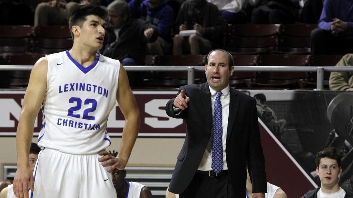 Lexington Christian coach Nate Valentine talks to Kyle Rode while playing University Heights in the first round of the All 'A' Classic at Alumni Coliseum in Richmond, Ky., Thursday, January 25, 2018.