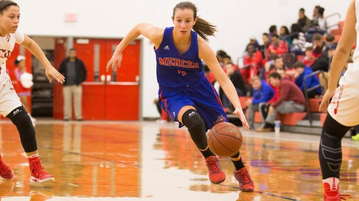 Mercer County Titans guard Seygan Robins (4) drove to the basket against Butler. She’s one of several standout scorers for No. 1 Mercer County, whose only in-state losses this season were to No. 2 Butler and No. 3 Male.