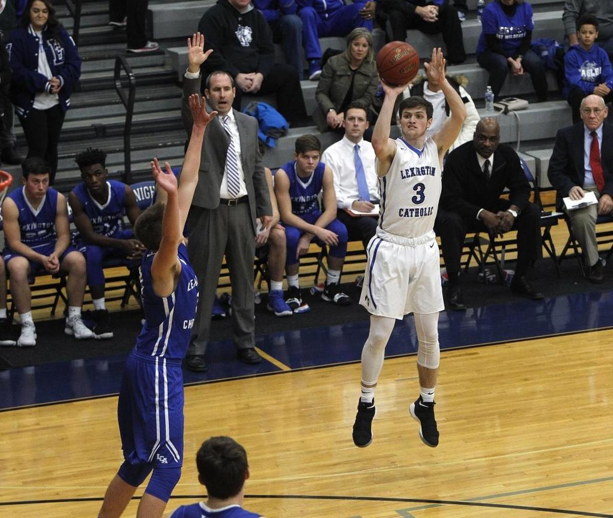 Lexington Catholic's T. C. Price shoots a 3-pointer against Lexington Christian in the Bueter Gymnasium at Lexington Catholic in Lexington, Ky., Tuesday, January 2, 2018.