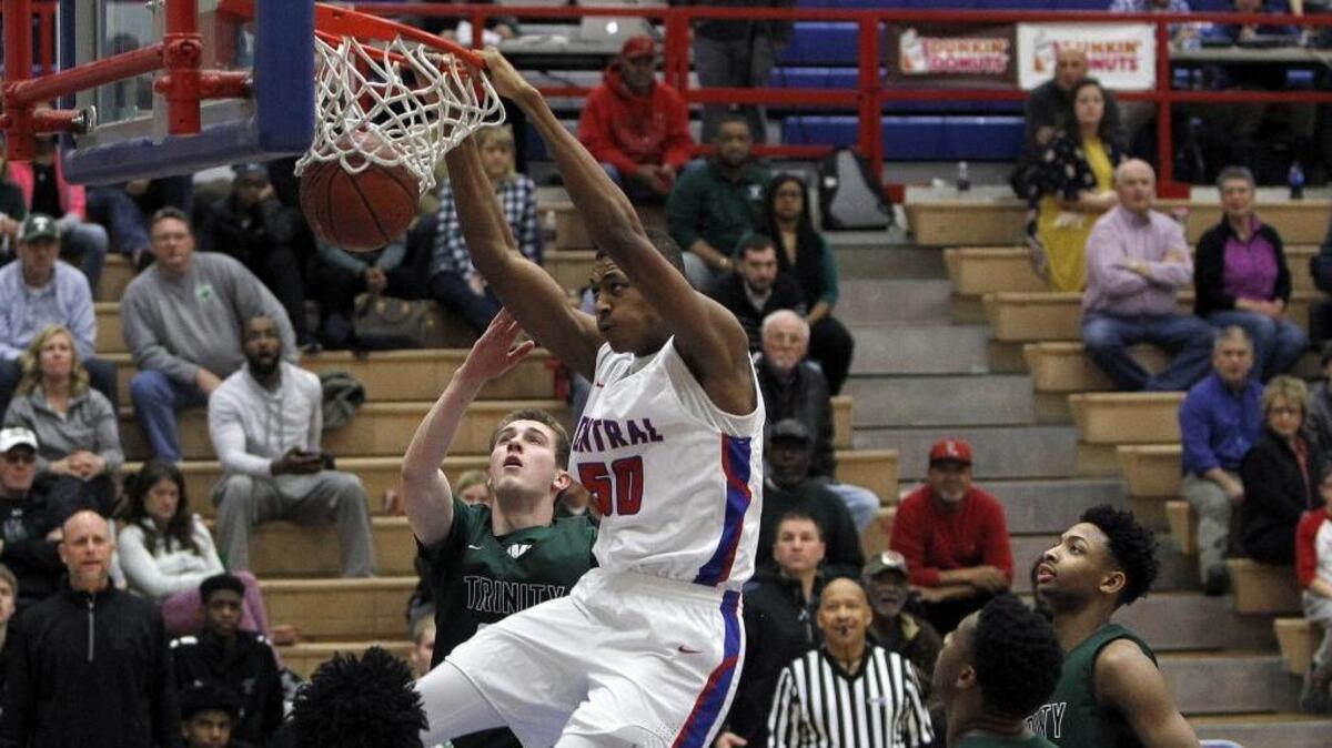 Madison Central’s Isaiah Cozart dunks during the No. 5 Indians’ 53-52 defeat of No. 3 Trinity in Richmond on Friday night. Go to Kentucky.com/sports for a report on the game.