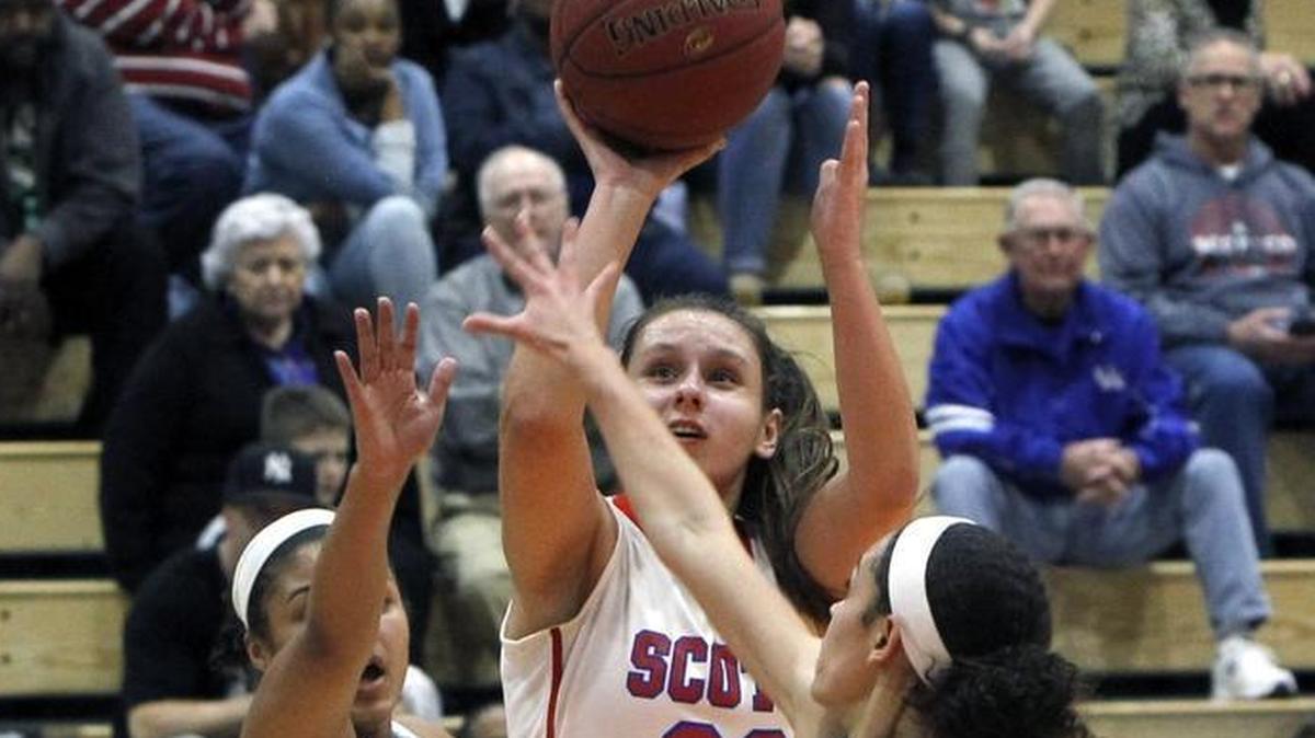 Scott County's Peyton Riddle shot Friday night against Henry Clay during the girls' 42nd district championship at Frederick Douglass.