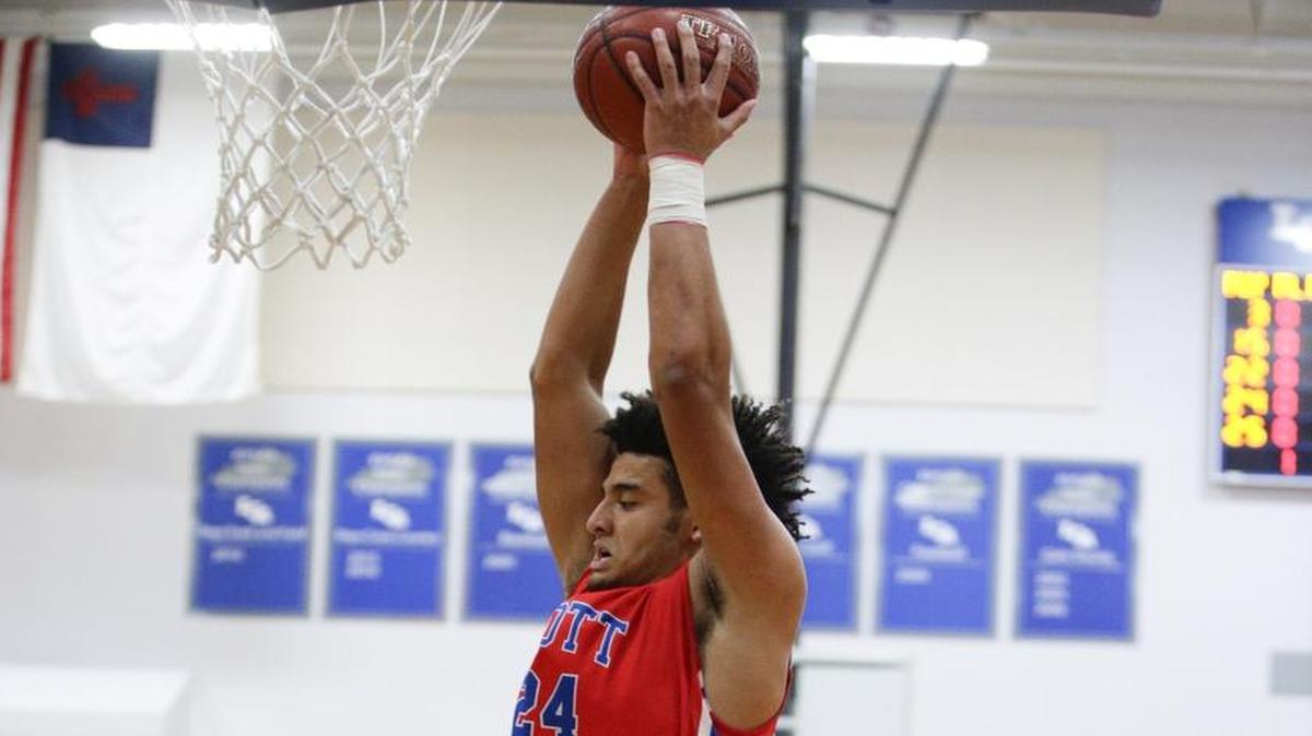 Scott County's Michael Moreno pulled down a rebound against Lexington Christian on Dec. 7, 2016 in Lexington.
