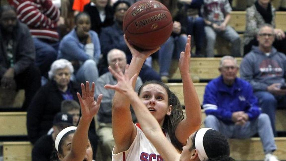 Scott County’s Peyton Riddle took a shot Friday night against Henry Clay during the girls’ 42nd District championship at Frederick Douglass.