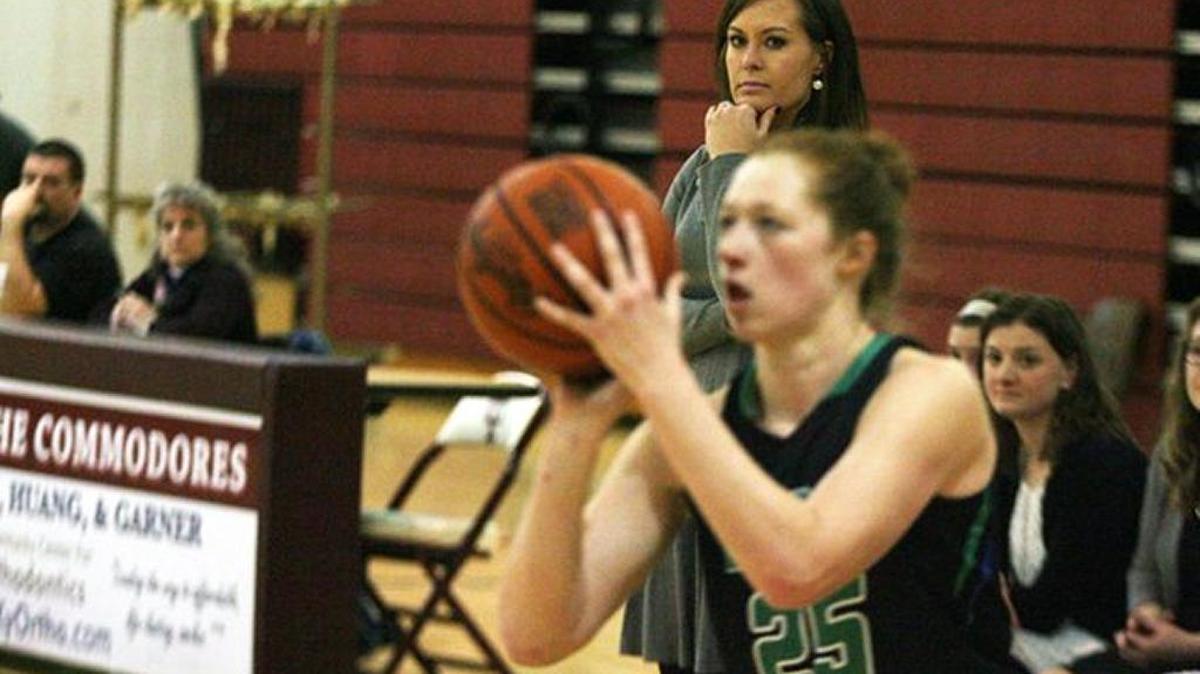 Jacqueline Coleman, background, coached East Jessamine and her daughter Emma Young a year ago and thought she was done with coaching for a while after last season. Instead, she was called back into duty by Nelson County.