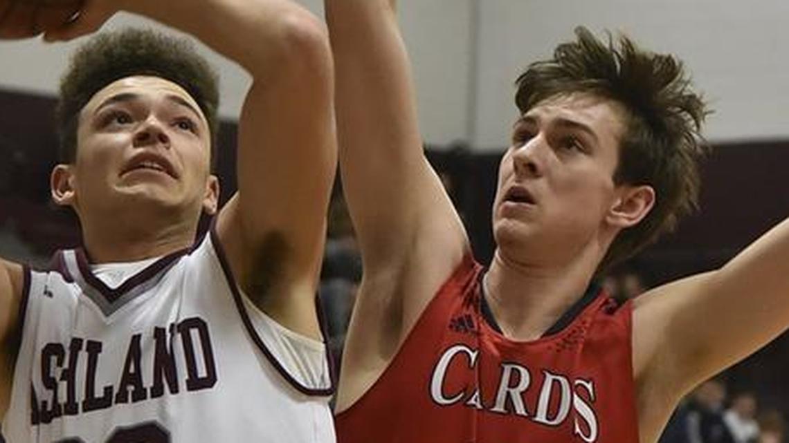 Clark County's Brennan Canada (13) defended a shot by Ashland Blazer’s Devaunte Robinson on Dec. 18, 2017. On Wednesday, Clark County topped Bracken County 72-51 in the 10th Region tournament.