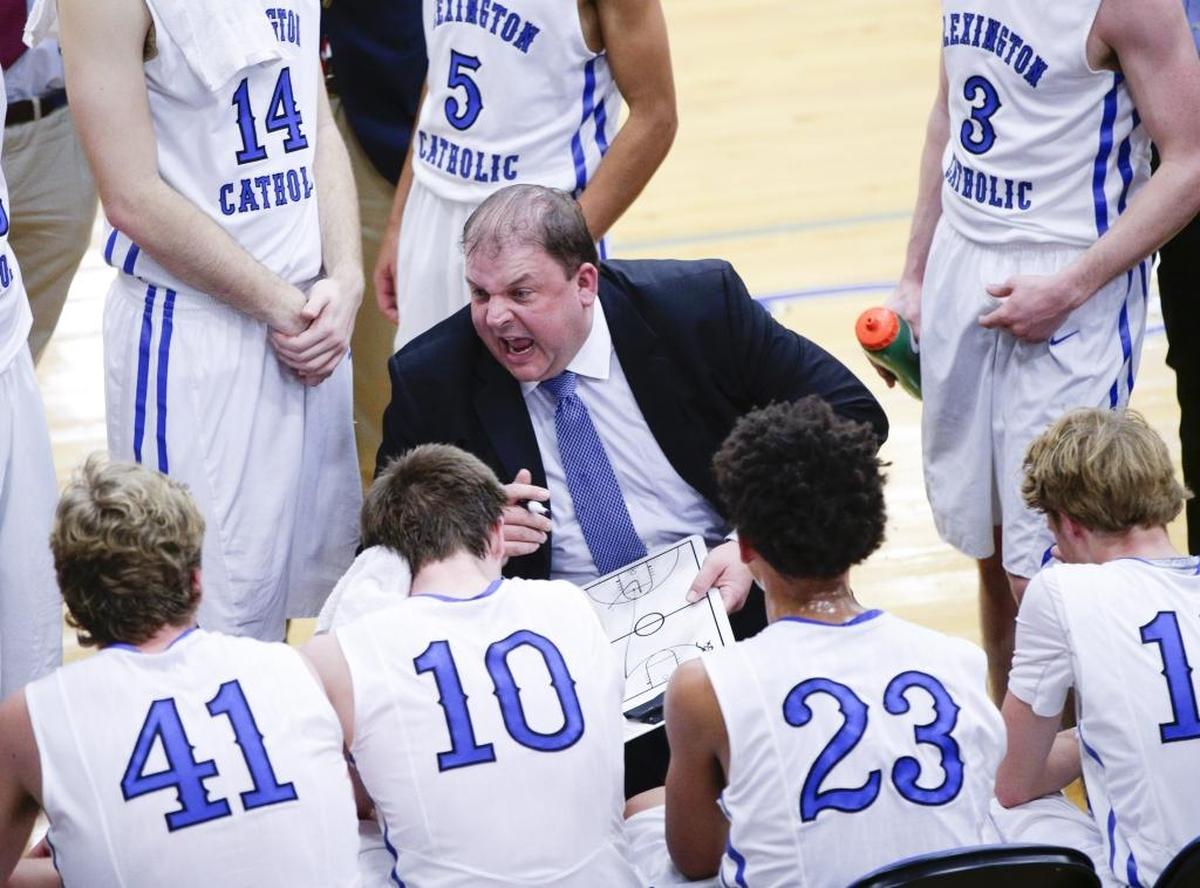 Lexington Catholic coach Brandon Salsman all over his team in the first half as Lexington Catholic defeated Dunbar 53-52 on Thursday January 18, 2017 in Lexington, Ky.