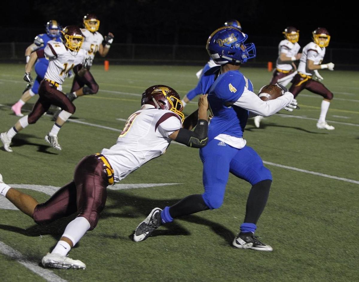Henry Clay's Tyree Clark is horse-collared but didn't get the flag as he runs against Cooper at Dr. Robert Feld Stadium in Lexington, Ky., Friday, October 27, 2017.