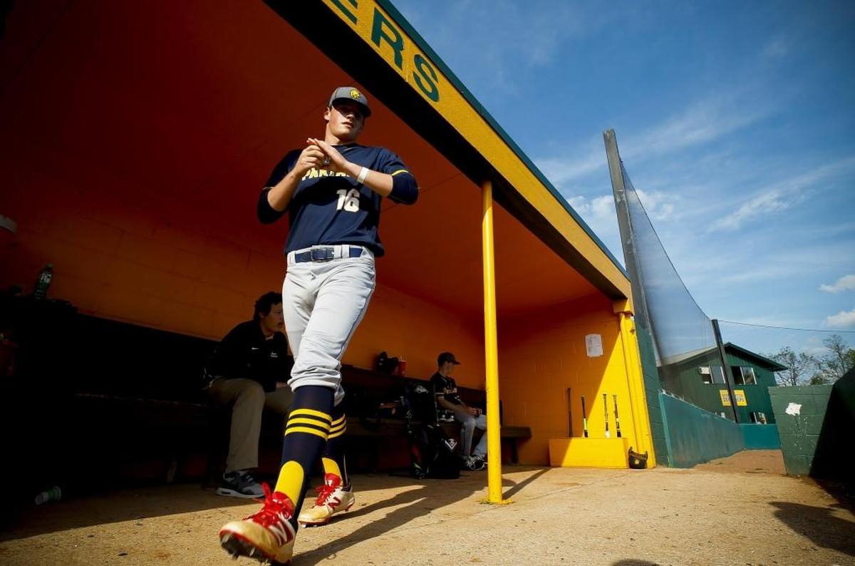 Sayre's Cameron Stiglich (16) warms up in the dugout before a game against Bryan Station at Bryan Station High School in Lexington, Ky., Wednesday, April 19, 2017.