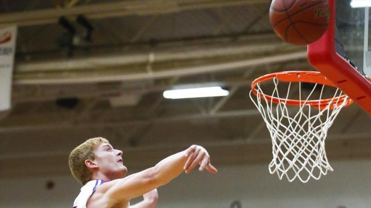 Scott County's Cooper Robb (10) blocks a shot from Lexington Christian's Will Hacker (12) during their game at Scott County High School in Georgetown, Ky., Thursday, Dec. 7, 2017. Scott County beat Lexington Christian 68-59.