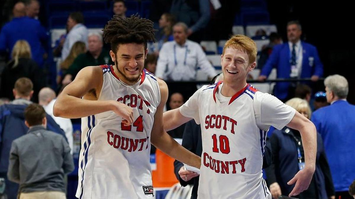 Scott County's Michael Moreno, left, and Cooper Robb, right, celebrated after as Scott County defeated Trinity in an opening round game at the 101st Whitaker Bank/KHSAA Boys' Sweet Sixteen state basketball tournament being played Wednesday at Rupp Arena in Lexington. This is fourth quarter action. Scott Co. won 54-53 on a 3-pointer by Robb with 5 seconds left in the game.