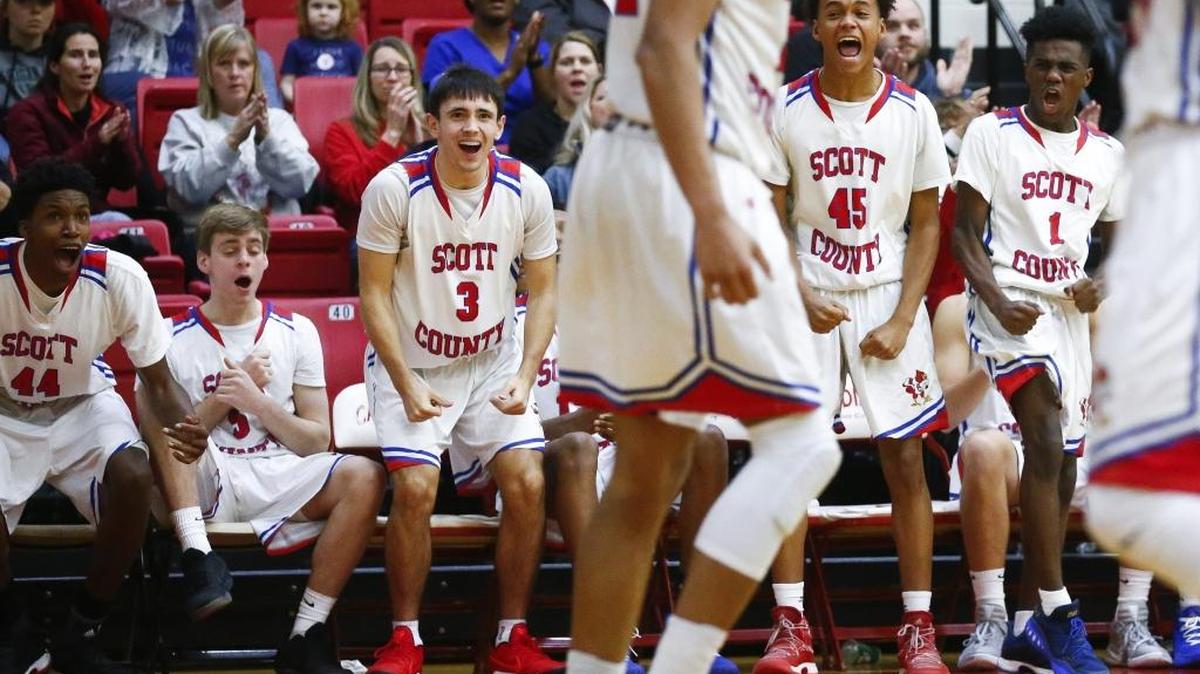Scott County's Jaylen Barber (44) Michael Mckenzie (5) KJ Tucker (3) Kobi Harris (45) and Cam Fluker (1) celebrate a basket from Scott County's Michael Moreno (24) during their game at Scott County High School in Georgetown, Ky., Thursday, Dec. 7, 2017. Scott County beat Lexington Christian 68-59.