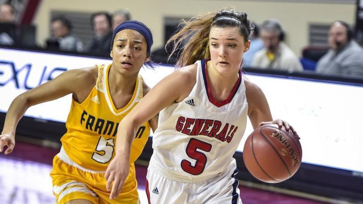 Lafayette's Caroline Bennett (5) drives around Franklin County's Princess Stewart (5), during the girls 11th Region Tournament finals, Saturday, March 4, 2017, at EKU's McBrayer Arena in Richmond.