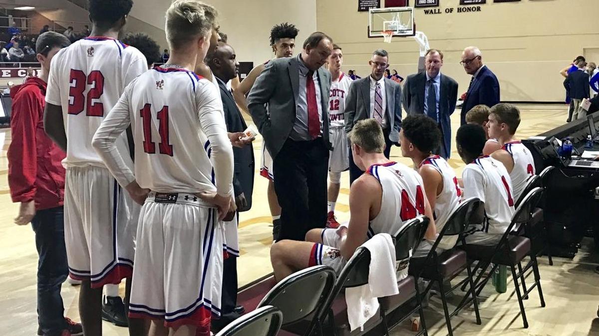 Scott County Coach Billy Hicks talked to his team during a timeout in the Boys’ 11th Region Tournament in Richmond on Thursday night.
