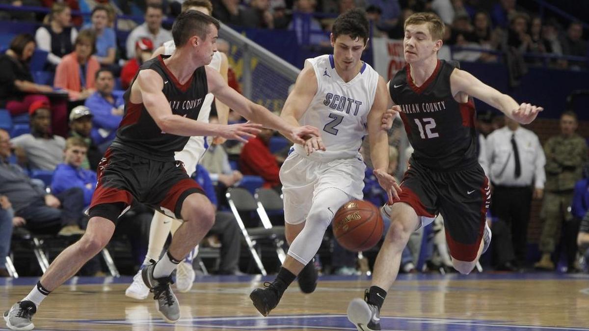 Harlan County pressures Scott's Jake Ohmer during the first round of the Whitaker Bank/KHSAA Boys' Sweet 16 at Rupp Arena in Lexington, Ky., Wednesday, March 15, 2017.