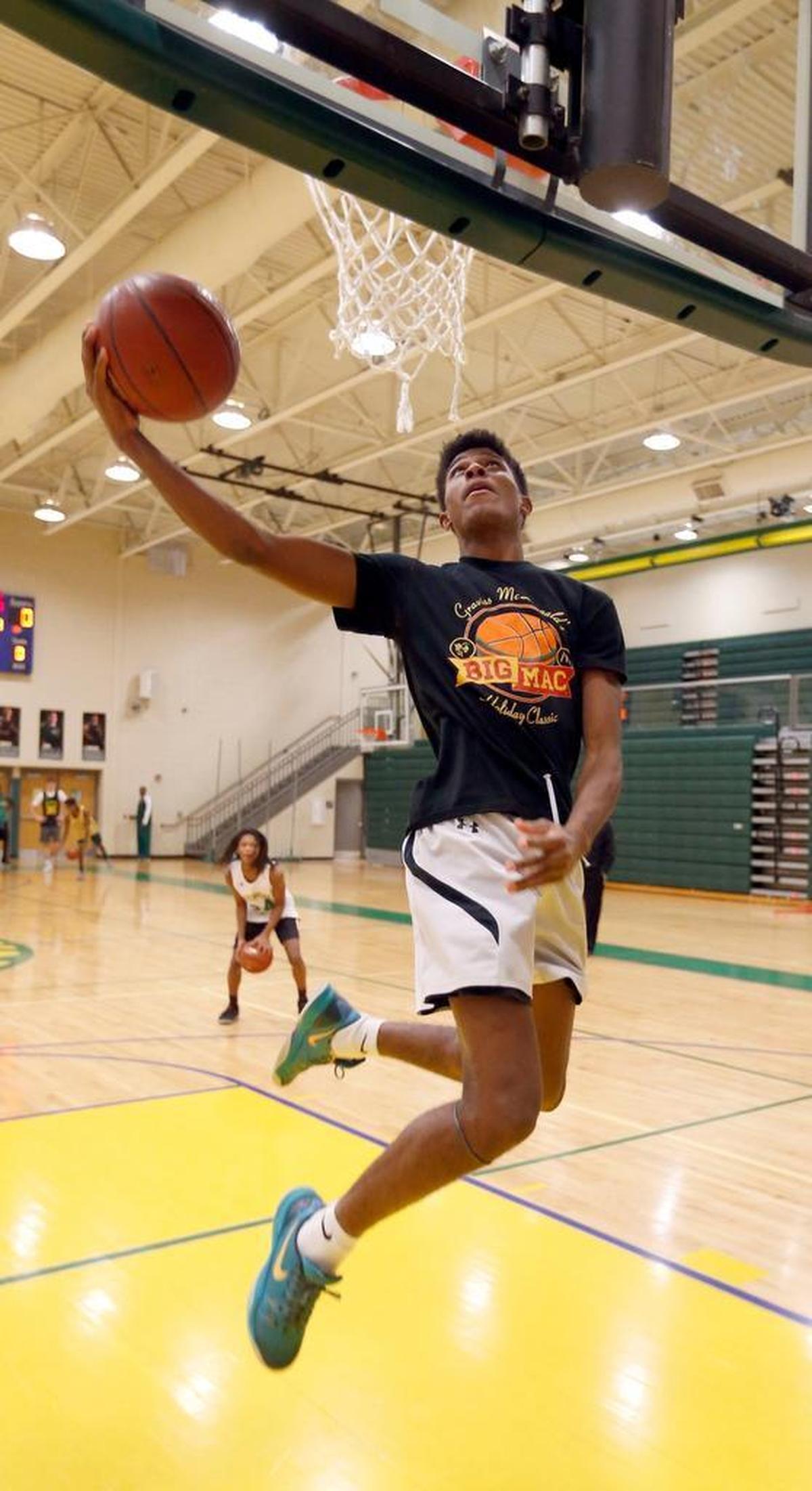 Terrance Clayton-Murphy shot a layup as the Bryan Station High School boys' basketball team practiced in the school gymnasium in Lexington, Ky., Wednesday, December 20, 2017. Bryan Station boys' basketball is off to the best start in years, defeating four city teams and two ranked teams so far.