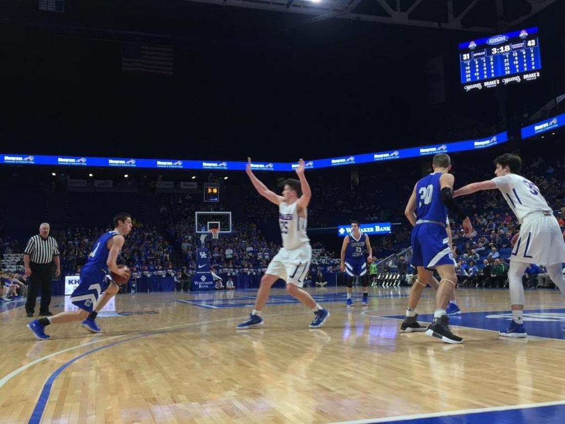 CJ Fredrick, left, prepared to attack the Apollo defense during Covington Catholic’s game against the Eagles in the first round of the 101st Whitaker Bank/KHSAA Boys’ Sweet Sixteen on March 15, 2018, at Rupp Arena.