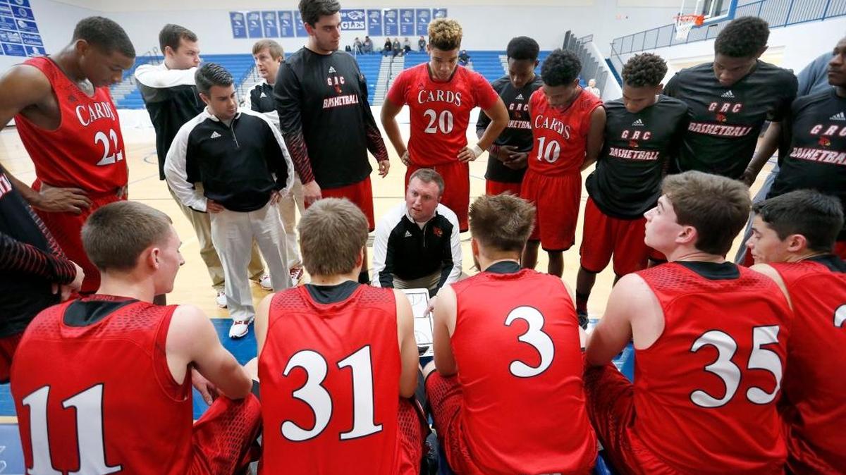 Clark County head coach Josh Cook, center, talked to his team during a timeout in their game against Jeffersontown in the Central Bank Classic at Lexington Christian Academy on Thursday, Dec. 22, 2016. Clark won 62-46.