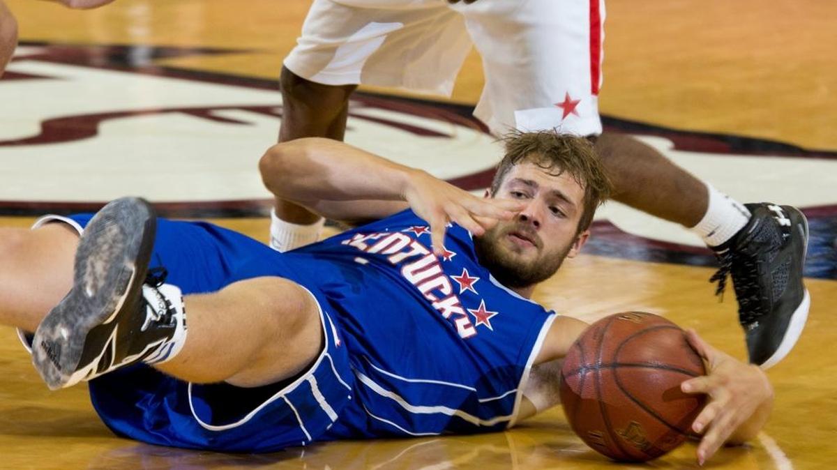 Kentucky Boys All-Star Carson Williams dives after a loose ball in the first half. The Kentucky vs. Indiana All-Star Classic was held, Sunday, June 12, 2016 at Bellermine University's Knights Hall in Louisville.