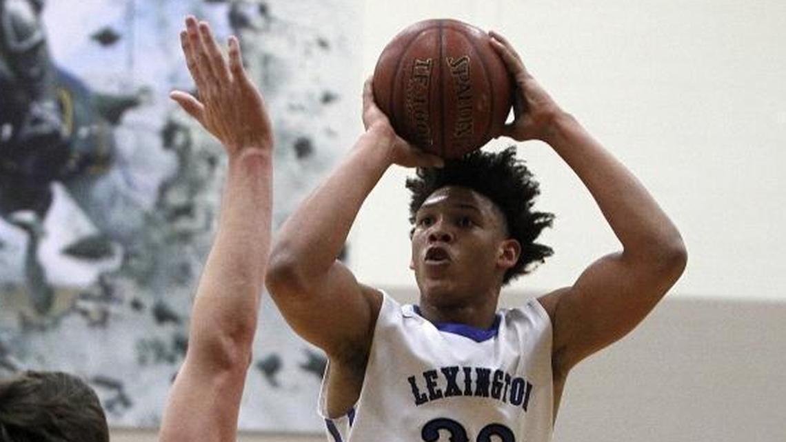 Lexington Catholic's Zan Payne shot against Lexington Christian's Austin Hall on Jan. 2. On Friday, Payne scored 13 points in the Knights’ overtime win against the Eagles before leaving the game with a leg injury.